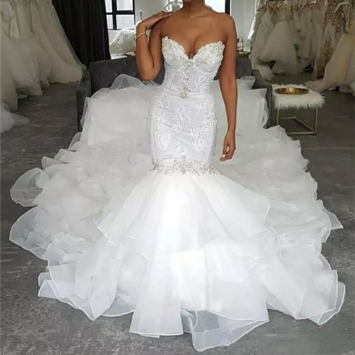 Fitted mermaid wedding dress with long train